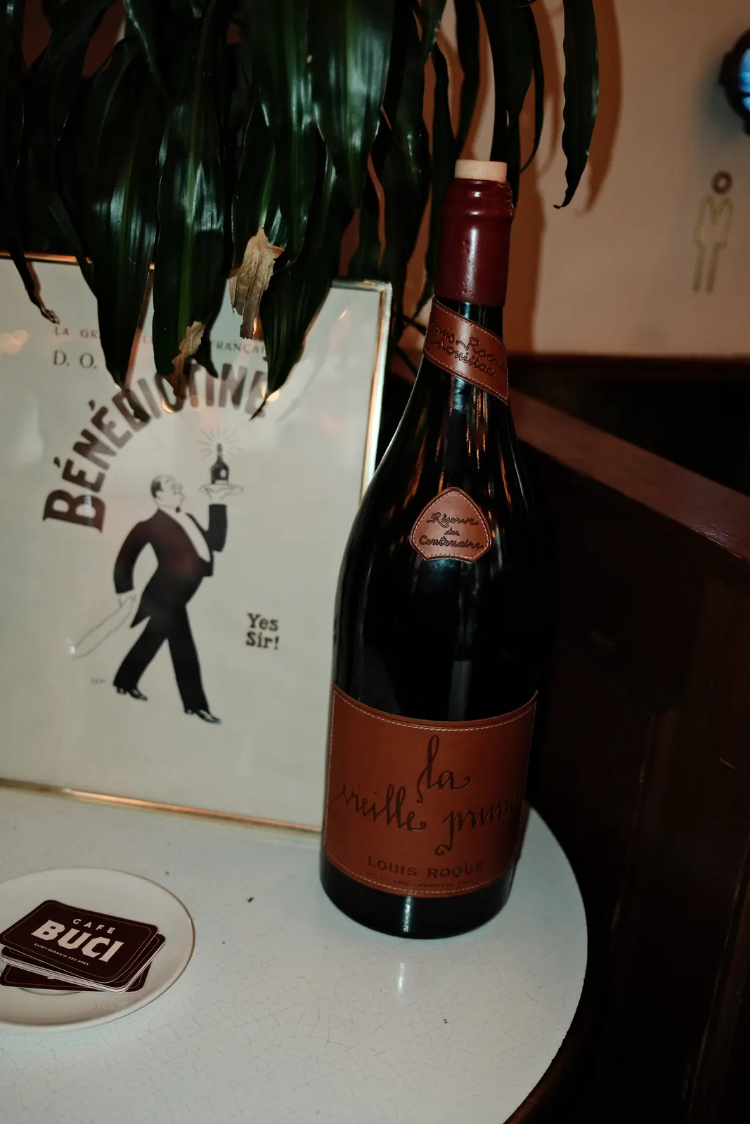A bottle on the counter, vintage poster